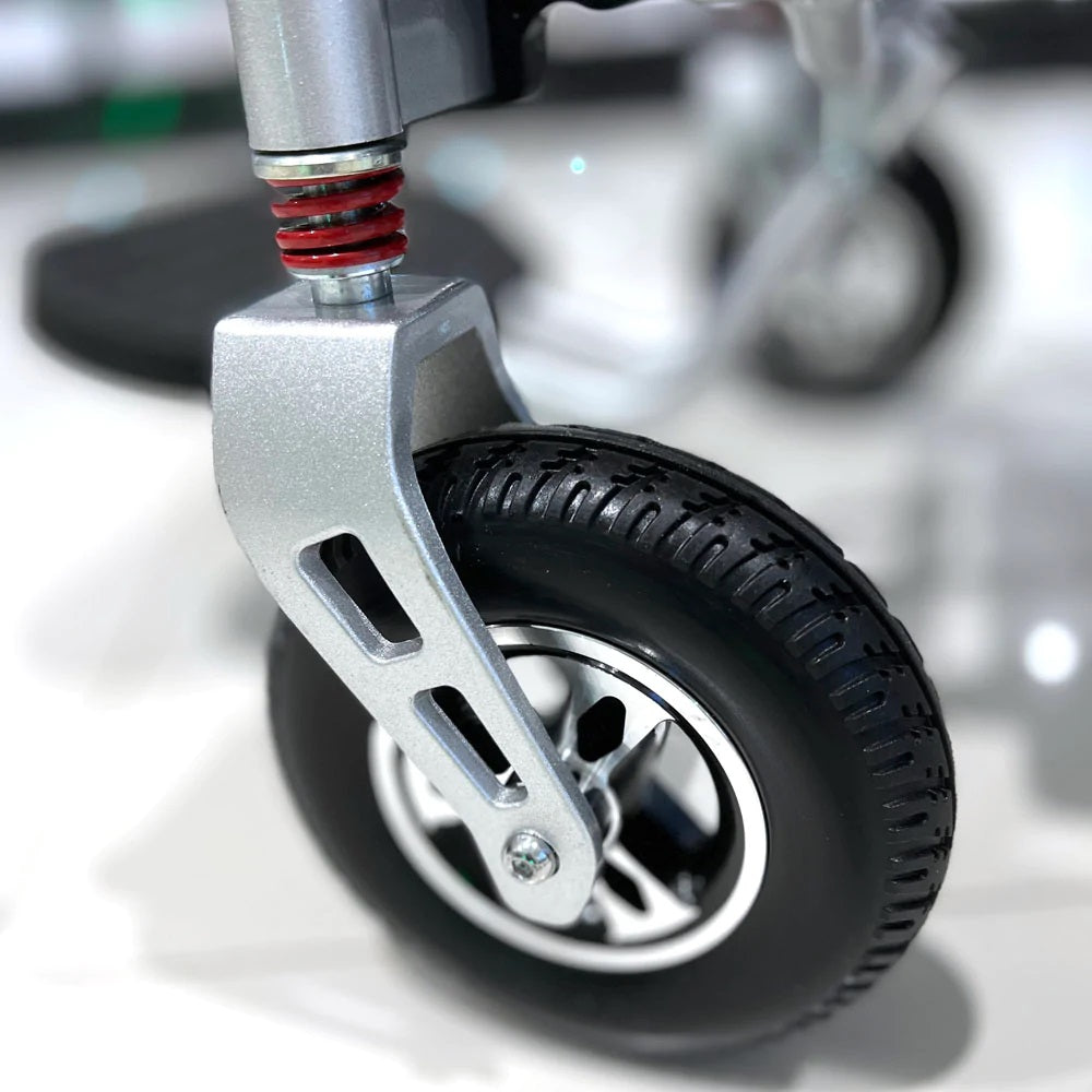 CN-6012 remote control enabled electric wheel chair, front tire view