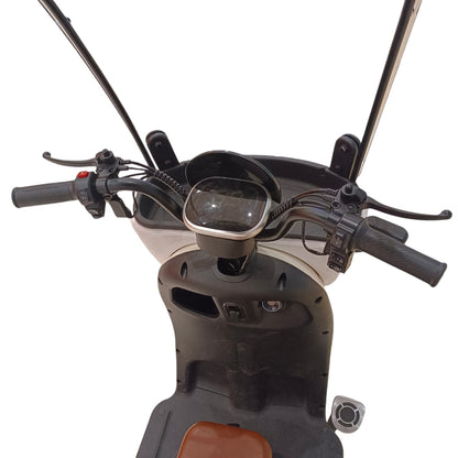 Driver cockpit of V1 Tri-Wheel Two Seater E-Bike with Roof featuring digital display, handlebar controls and windshield.