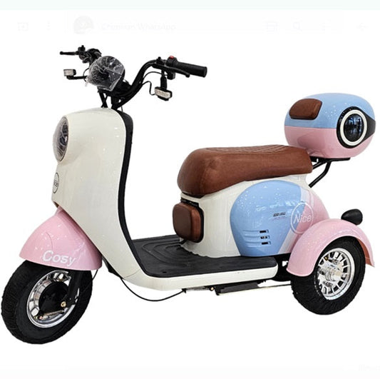 CM-03 Tri-Wheel Two Seaters Cute Mobility E-Bike with baby seat and rear luggage box front three-quarter view in pastel pink and blue