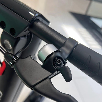 X11 MAX electric scooter handlebar brake lever and safety bell close-up