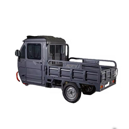 Rear three-quarter view of Windhorse electric cargo tricycle with spacious open loading platform.