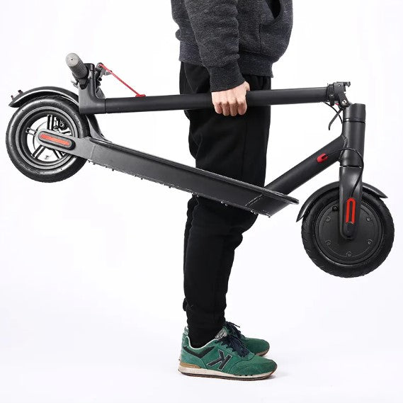 M365 Foldable E-Scooter lightweight folding frame being carried by hand.